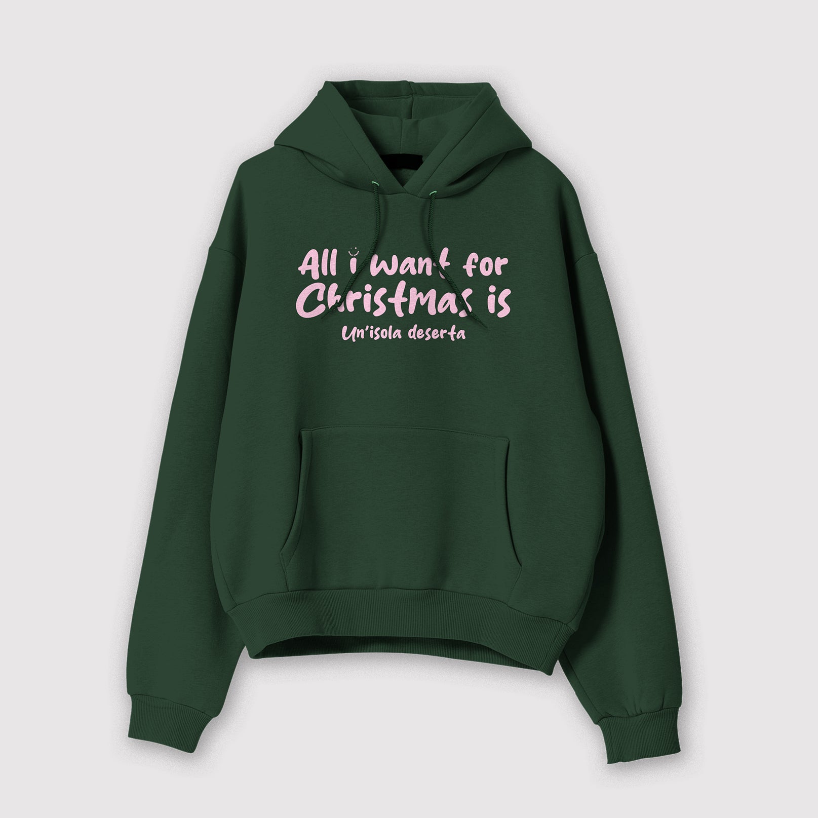 Mockup felpa uomo verde con cappuccio in cotone organico e scritta rosa “All i want for Christmas is Un'isola deserta” Totally Random