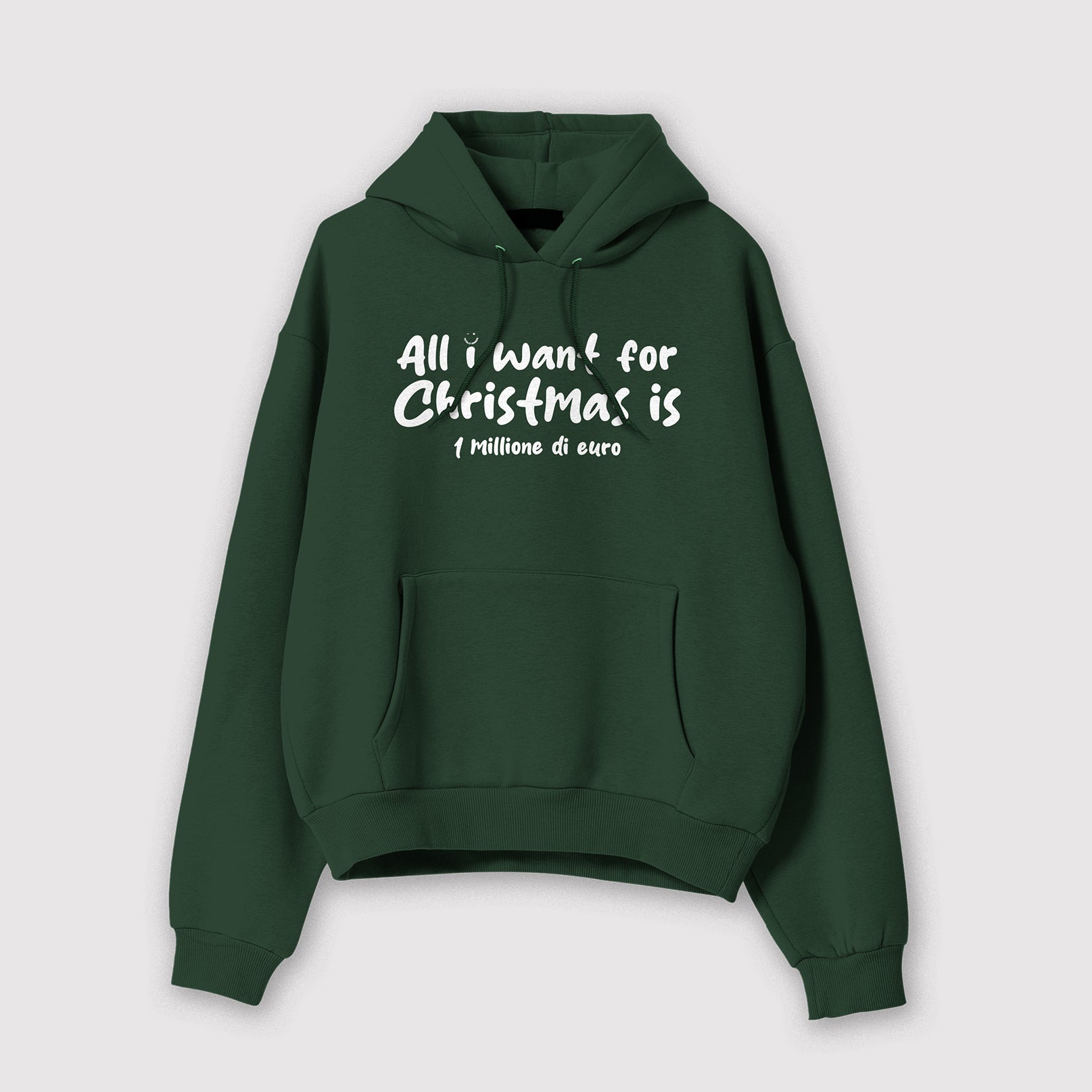 Mockup felpa uomo verde con cappuccio in cotone organico e scritta bianca “All i want for Christmas is 1 milione di Euro” Totally Random