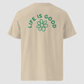 mockup retro maglietta unisex beige con icone di fiore e scritta verde sulla schiena Life Is Good - Totally Random®